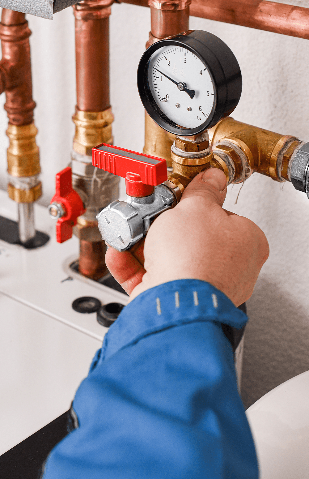 A Nearby Plumbing technician working on copper pipes